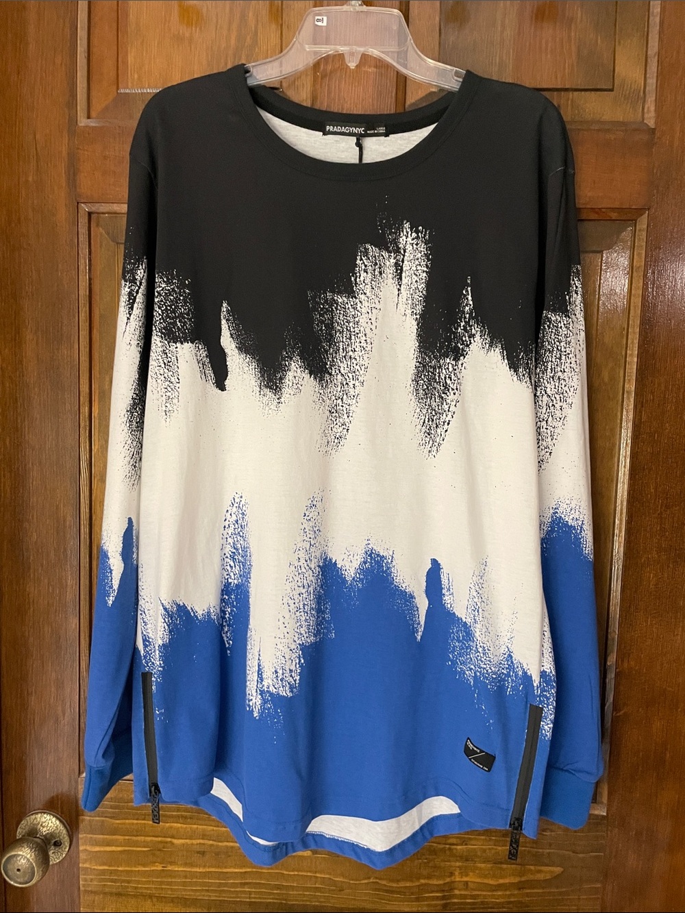 PRADAGYNYC multi-color long sleeve T, side zip, curved hem, “BLESSED” on back